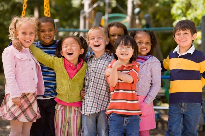 A group of children playing at the park