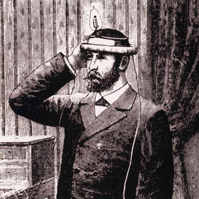 Illustration of Nikola Tesla wearing a headpiece adorned with lightbulbs