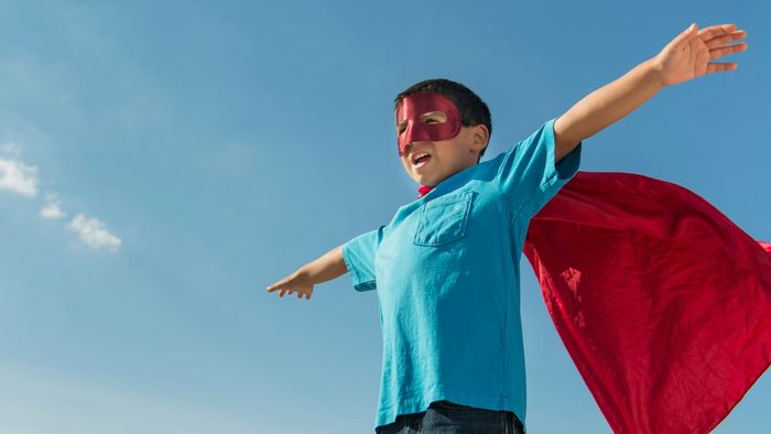 Boy in superhero costume.