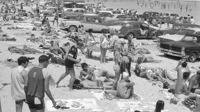 People are featured at the beach in a story about 1960s slang terms