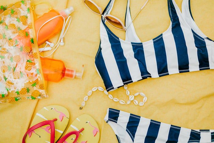 Best February Buys: Overhead View of a Bikini and Sunscreen