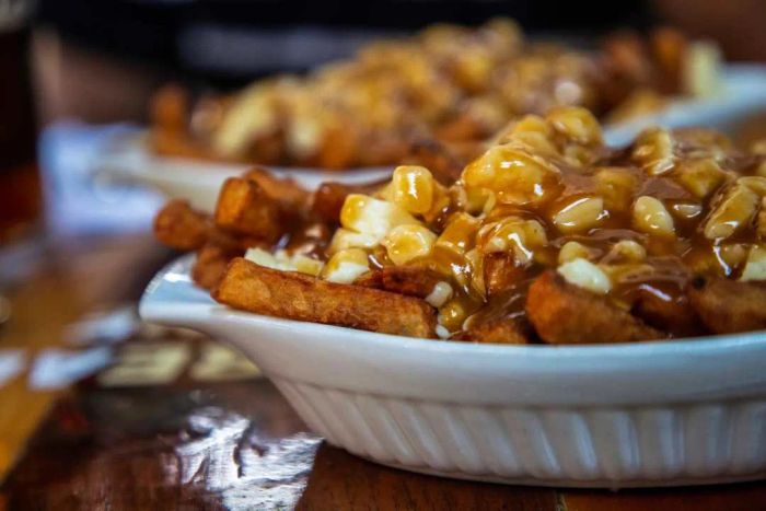 Two servings of poutine