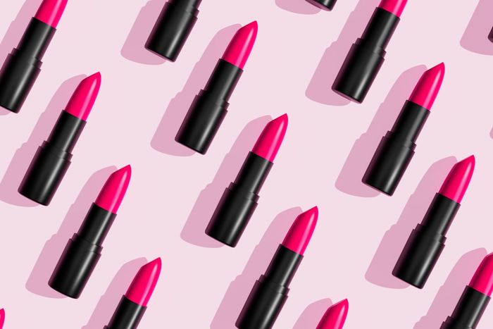 lipsticks displayed on a pink background