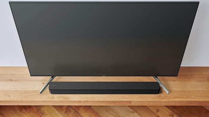 A soundbar positioned below a television screen.