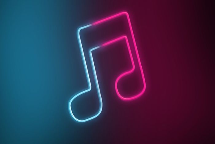 a neon music note in blue and pink