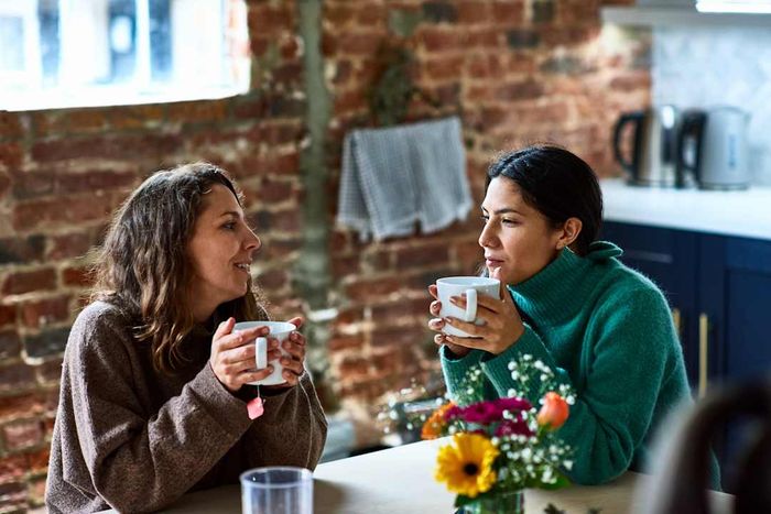 photo of two women enjoying tea together at a cafe