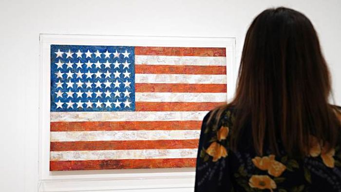 Jasper Johns’s renowned artwork ‘Flag’ is showcased at the Museum of Modern Art.