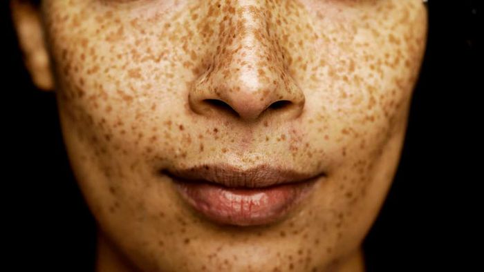 A close-up of a woman’s nose and mouth