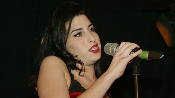 Amy Winehouse performs during the announcement of The Brit Awards shortlist at London's Park Lane Hotel in 2004.