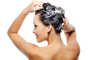 a woman washing her hair