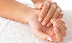 Forearms and hands emphasizing the beauty of fingernails