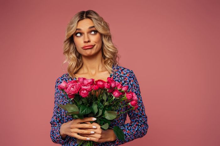 A woman holding a bouquet of flowers