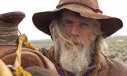 rugged cowboy with weathered skin