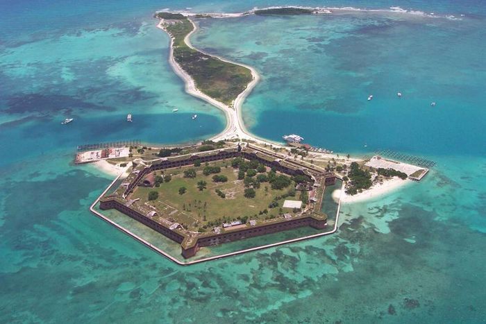 A bird’s-eye view of Fort Jefferson at Dry Tortugas National Park, encircled by vibrant turquoise waters.