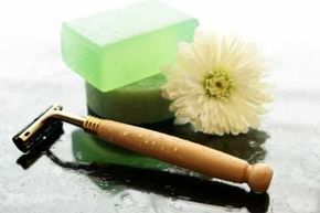 A razor accompanied by a flower and soap