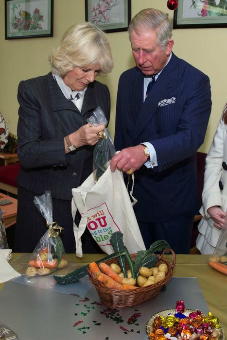 Charles and Camilla preparing Christmas hampers in 2012.