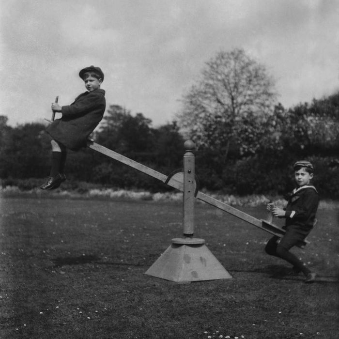 Children Playing on a Seesaw
