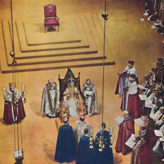 Queen Elizabeth II seated on the Coronation Chair.