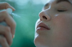A woman moisturizing her skin.