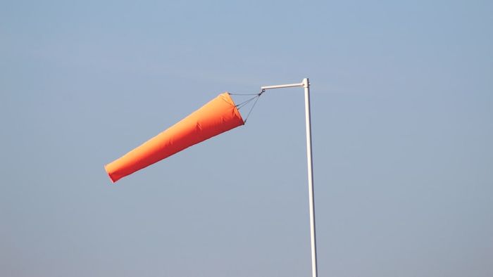 An orange windsock on display
