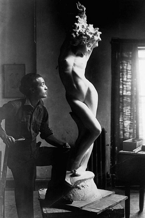 Isamu Noguchi immersed in his creative process.
