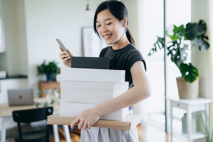 Image of a woman holding multiple boxes