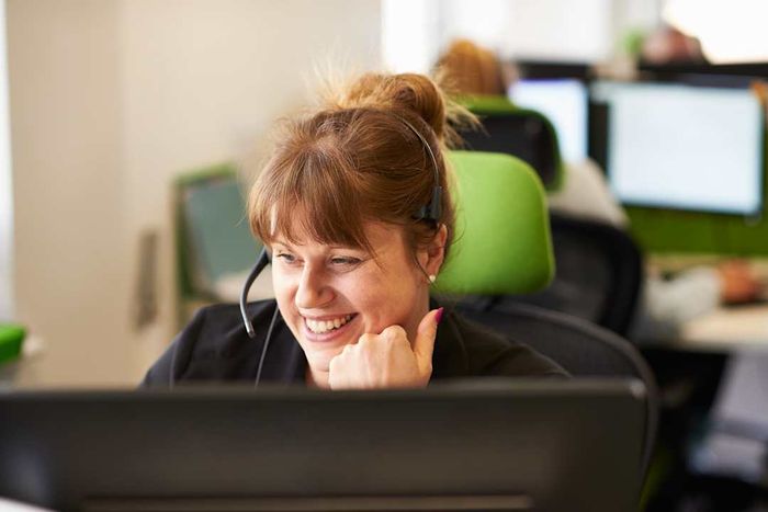 Woman answering a call in a call center