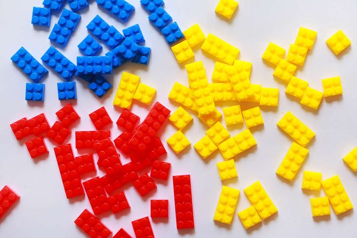 Plastic bricks in blue, red, and yellow