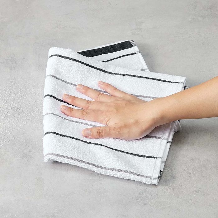 Top Amazon Basics Kitchen Essentials Under $50: Amazon Basics Cotton Kitchen Dish Towels, Set of 4 shown here.