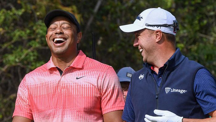 An image of Tiger Woods and Justin Thomas is shown
