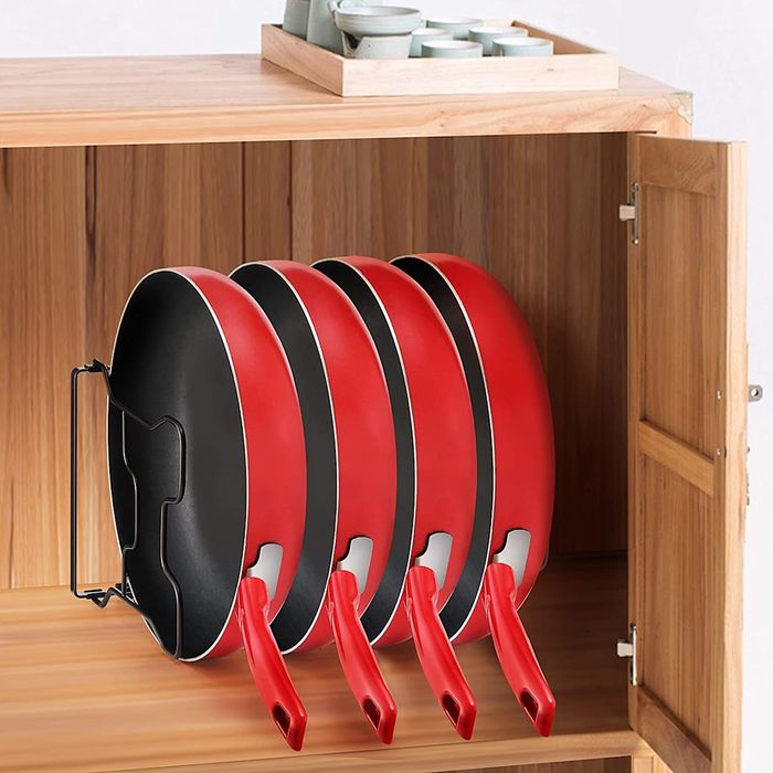 Simple Trending Pan and Pot Lid Organizer in wood cabinet.