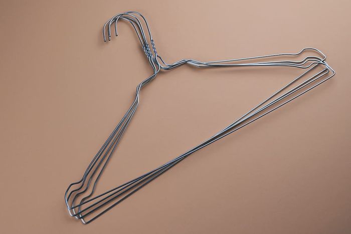 Wire hangers placed on a brown surface