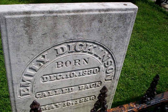 A photograph of Emily Dickinson's tombstone.
