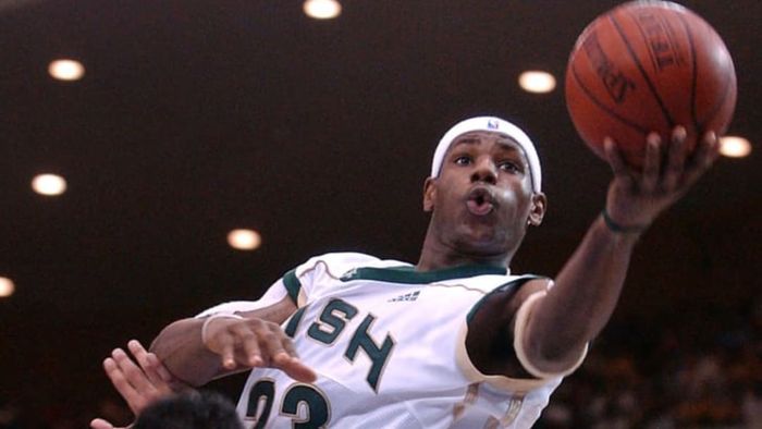 LeBron James goes up for a basket during a game with his St. Vincent-St. Mary's high school team in January 2003.