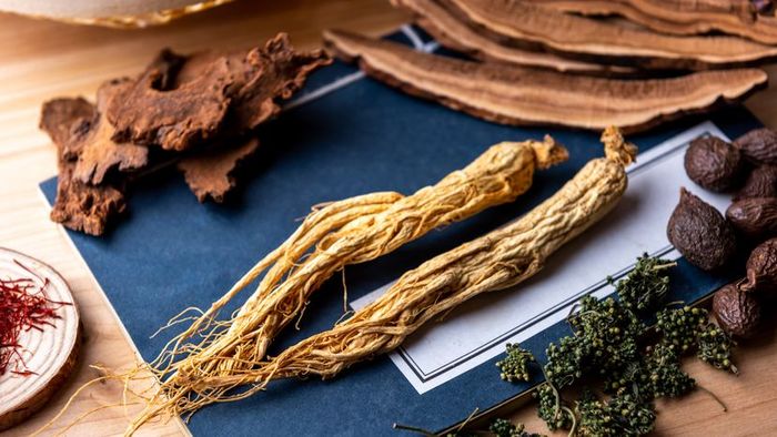 A collection of Traditional Chinese herbs arranged on a table.
