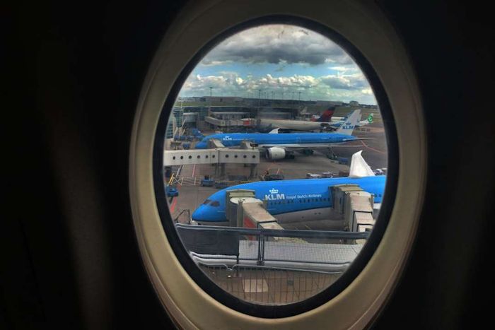 A view of KLM aircraft seen through a plane window