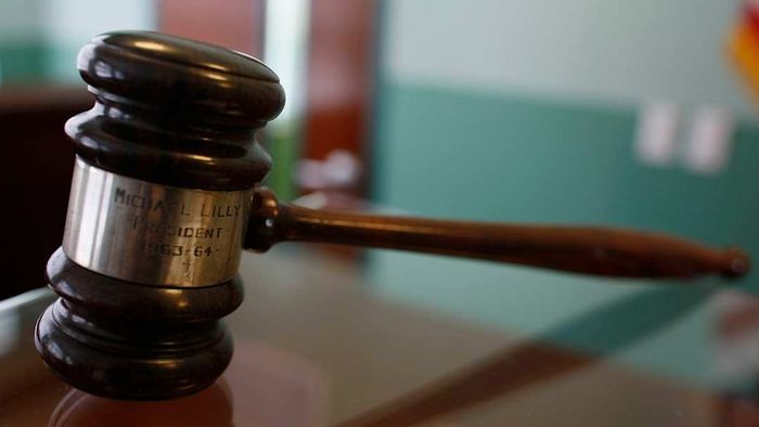 A gavel resting on a table