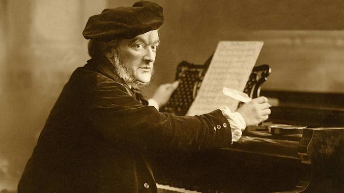 Richard Wagner seated at his piano, composing.
