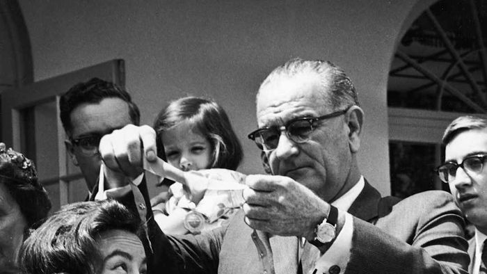 U.S. President Lyndon B. Johnson presenting the Federal Aviation Agency's Gold Medal Award to Jerrie Mock.