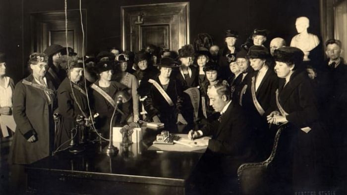 A group of women observes as Kentucky becomes the 24th state to ratify the 19th Amendment.