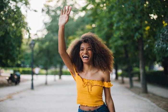 A woman waving.