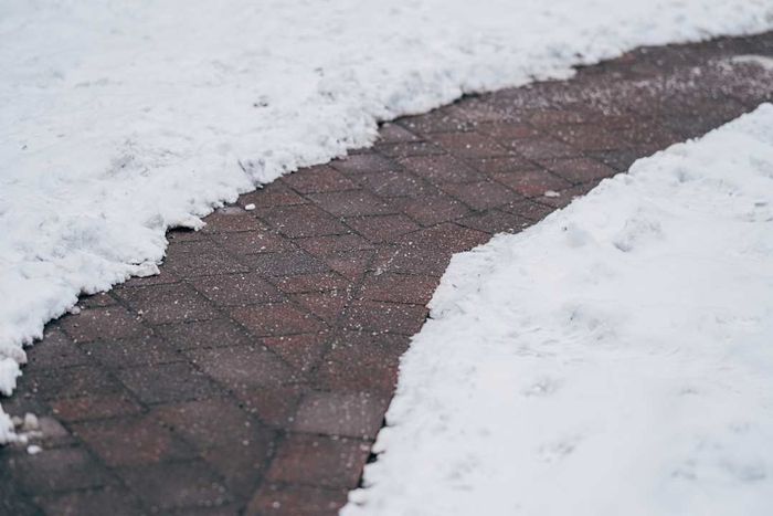 Shoveled walkway treated with rock salt
