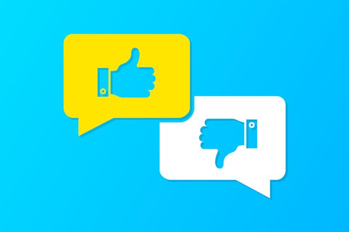 A background featuring thumbs up and down icons in blue.