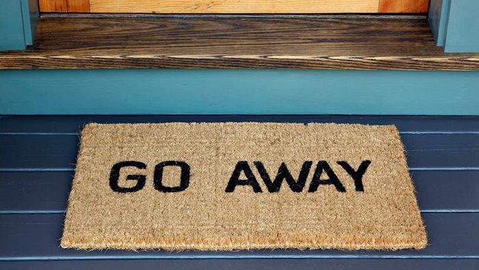 A doormat telling someone to leave.