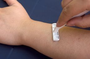 A person shaving their forearm.