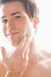 Man applying aftershave.