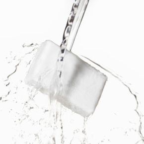 A bar of soap accompanied by splashing water.