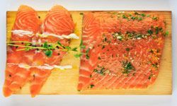 Freshly sliced salmon on a slab