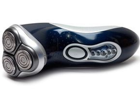 A standalone electric shaver placed on a white background.