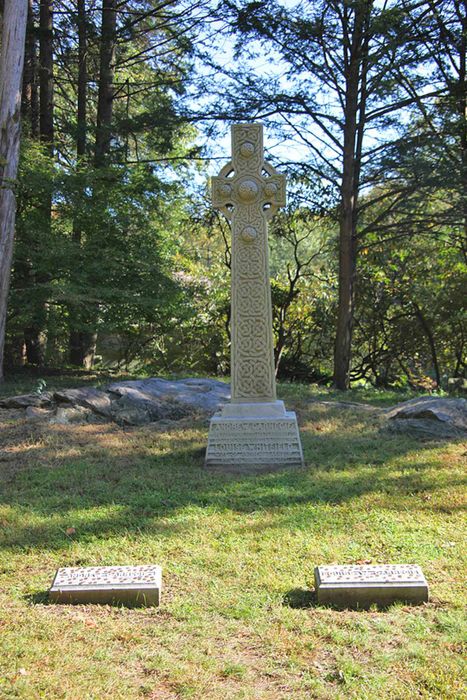 Carnegie's burial site features a Celtic cross and two modest gravestones.